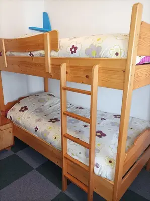 a pair of bunk beds in a room at Holiday Home Over The River in Bovec
