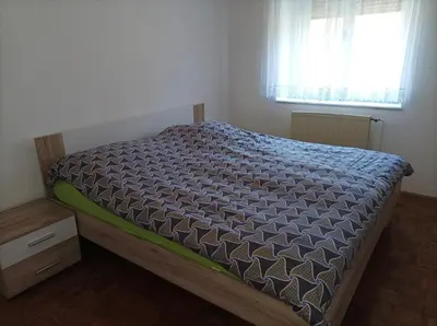 a bed in a small room with a window at Holiday Home Over The River in Bovec
