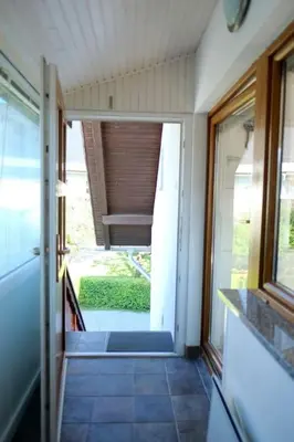 a hallway of a house with an open door at Apartment Pirnat in Bohinj