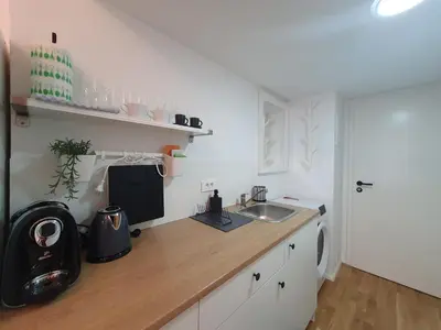 a kitchen with a sink and a counter top at Chic studios Wendy in centre Tour As Ljubljana in Ljubljana