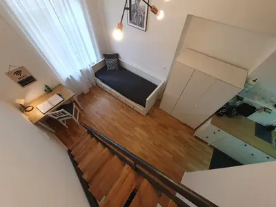 an overhead view of a living room with a couch at Chic studios Wendy in centre Tour As Ljubljana in Ljubljana