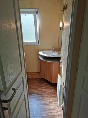 a bathroom with a sink and a window at Guesthouse Braslovče - Celje in Braslovče