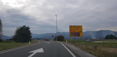 a highway with an arrow sign on the side of the road at Guesthouse Braslovče - Celje in Braslovče