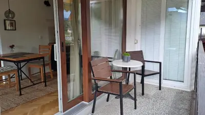 a dining room with a table and chairs and a table and chairsktop at FLAT FOR 2 - Alpine Dream Bled in Bled