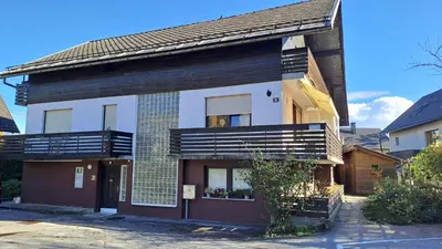 a house with a balcony on the side of it at FLAT FOR 2 - Alpine Dream Bled in Bled