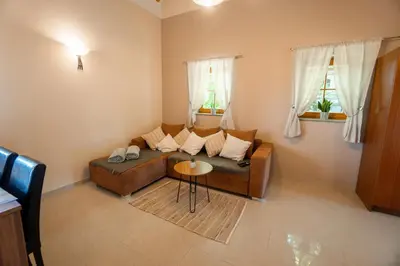 a living room with a couch and a table at Villa VINEYARD in Velika Nedelja