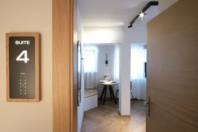 a door leading into a room with a table at M16 Apartments in Ljubljana