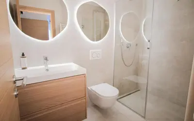 a bathroom with a toilet and a sink and a shower at M16 Apartments in Ljubljana