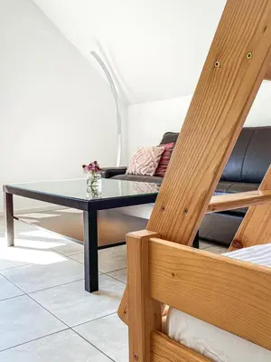 a living room with a table and a couch at The View 22 in Cerklje na Gorenjskem