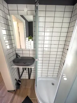 a bathroom with a shower and a sink at Riverside studio 1 in Ljubljana