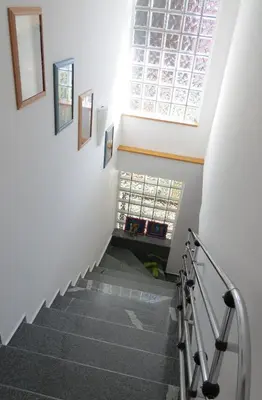 a stairway with a skylight and a window at Apartma AJDA in Velenje