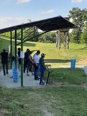 a group of people are standing under a canopy at Hisa jager in Gradišče v Slovenskih Goricah