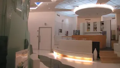 a room with a couch and stairs in a building at Happy Camp Mobile Homes in Camping Terme Čatež in Čatež ob Savi