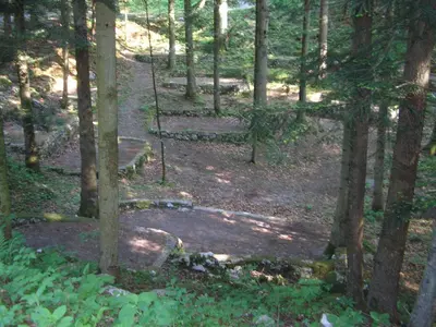a path in the woods with a swing at Camping Pivka Jama Postojna in Postojna