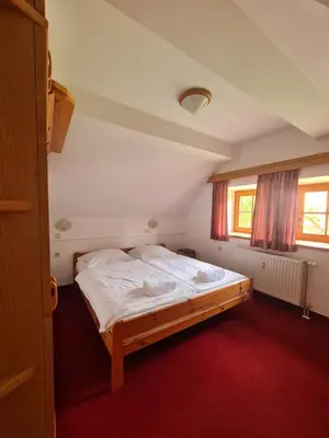 a bedroom with a large bed in a room at Apartment Moravske Toplice in Moravske Toplice