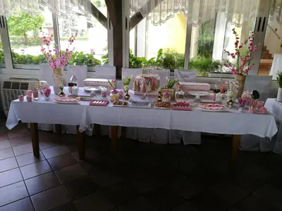 a table in a room with a white table cloth at Gostilna in prenočišče KOCJAN in Bizeljsko