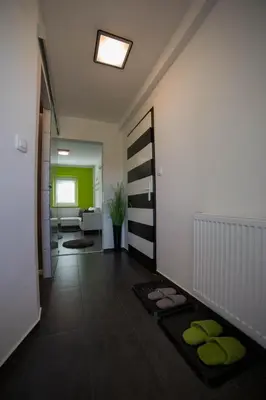 a room with a hallway with yoga mats on the floor at Naša hiša in Bohinj