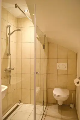 a bathroom with a shower and a toilet and a sink at Studio in Ljubljana Center in Ljubljana