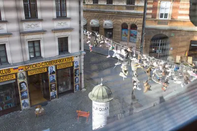 a group of people walking down a city street at Studio in Ljubljana Center in Ljubljana