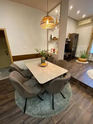 a dining room with a table and chairs at Robert's Apartment in Celje
