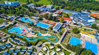 an aerial view of a resort with many pools at Počitniška hišica Patrik Terme Čatež in Mostec
