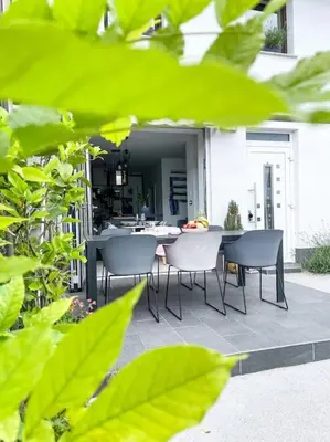 a patio with a table and chairs on a patio at Apartment *MALA* in Žalec