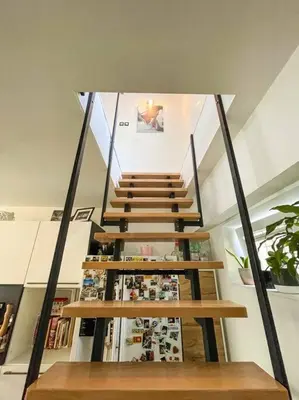 a staircase in a building with a stair case at Apartment *MALA* in Žalec