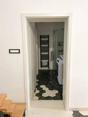 a hallway with a door leading to a room at Apartment *MALA* in Žalec