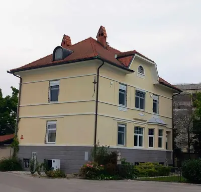 a large yellow house with a red roof at Apartment Lan in Homec