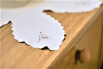 a piece of paper sitting on top of a wooden table at Kmetija Podobnik in Idrija