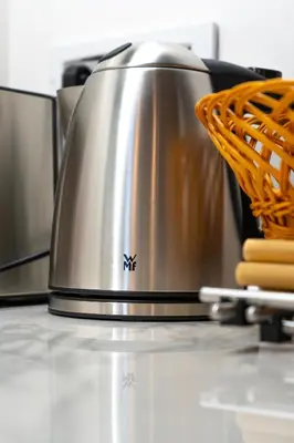 a tea kettle sitting on top of a counter at Downtown Luxury Retreat in Ljubljana