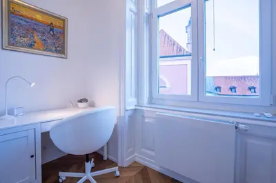 a bathroom with a white sink and a window at Downtown Luxury Retreat in Ljubljana
