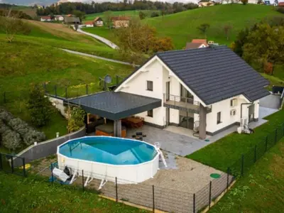 an aerial view of a house with a swimming pool at Vila Frigo Olimia in Podplat