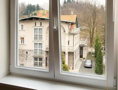 a window with a view of a city street at Studio My Ljubljana Home in Ljubljana