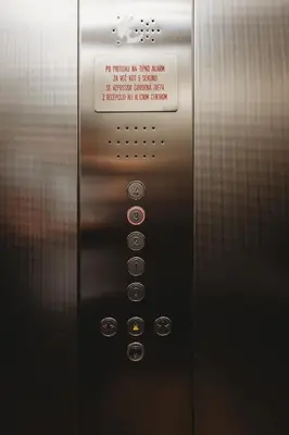 an elevator door with a sign on it at Romantic JUMP Studio overlooking river, free parking in Ljubljana