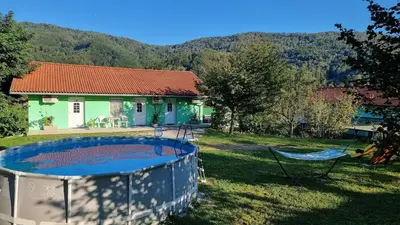 a house with a swimming pool in the yard at Apartma Patricija for 2 in Tolmin