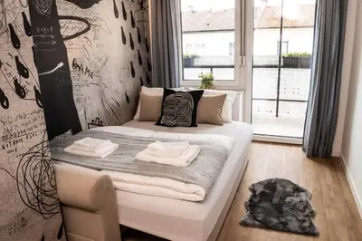 a room with a bed with two towels on it at Ljubljana Urban Apartments - Quiet Stay & Free Parking in Ljubljana