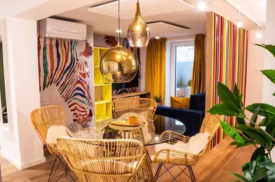 a living room with a glass table and chairs at Ljubljana Urban Apartments - Quiet Stay & Free Parking in Ljubljana