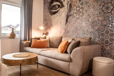 a living room with a couch and a table at Ljubljana Urban Apartments - Quiet Stay & Free Parking in Ljubljana