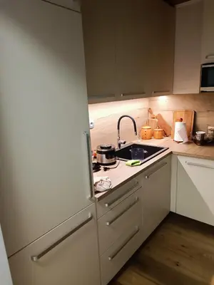 a kitchen with a sink and a stove top oven at House Apartma Čebela with jacuzzi in Gozd Martuljek