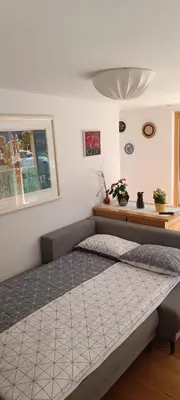 a bedroom with a bed in a room at House Apartma Čebela with jacuzzi in Gozd Martuljek