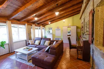 a living room with a couch and a table at The Hug of Nature in Dekani