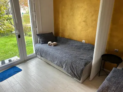 a bedroom with a bed with two stuffed animals on it at APARTMENT GAL in Novo Mesto