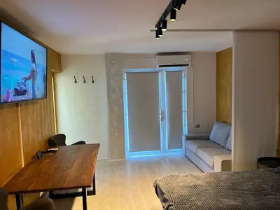 a room with a bed and a table and a couch at APARTMENT GAL in Novo Mesto