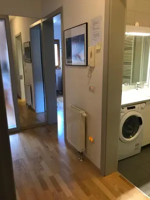 a laundry room with a washer and a washing machine at Apartment Lesnina in Kranjska Gora
