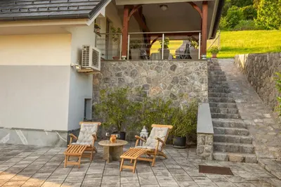 a group of chairs and a table on a patio at Holiday home in Smarjeske Toplice - Kranjska Krain 45723 in Smarjeske Toplice