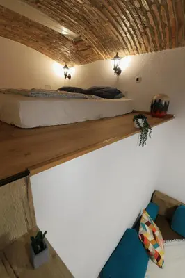 a bedroom with a bed in a room at Podroom Apartments in Ljubljana