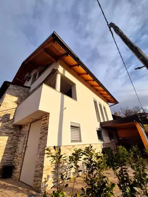 a building with a cross on the side of it at Apartment Teja in Brezovec