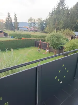 a view from the balcony of a garden with a playground at Apartma Dobrodošli pri Renati v Celju in Celje