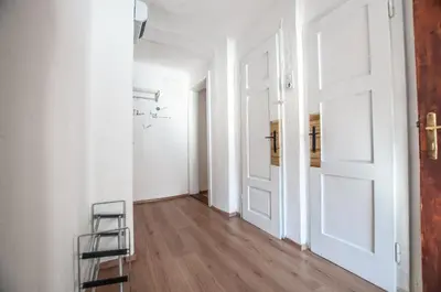 an empty hallway with a ladder and a door at Hostel, Rooms and Apartment Ceklin in Bohinj